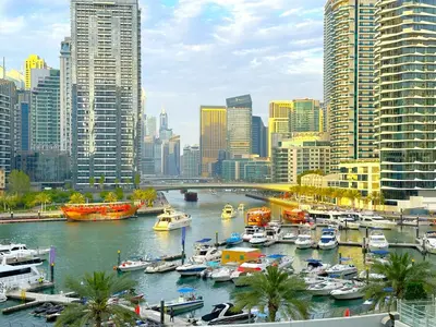 a group of boats docked in a harbor in a city at Lxury Brand New Studio w/ Balcony and Marina View in Dubai