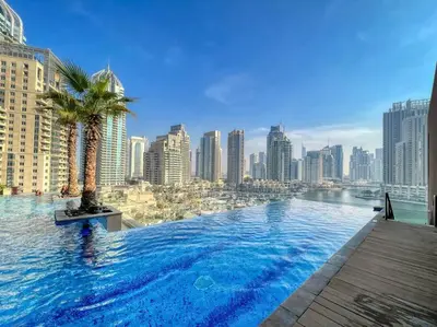a large swimming pool on top of a city skyline at FIRST CLASS 1BR High Floor with Magical View in Dubai