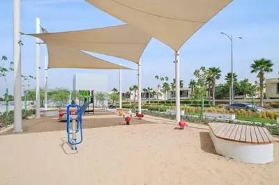 a playground with a large umbrella at Comfortable Studio in Damac Hills in Dubai
