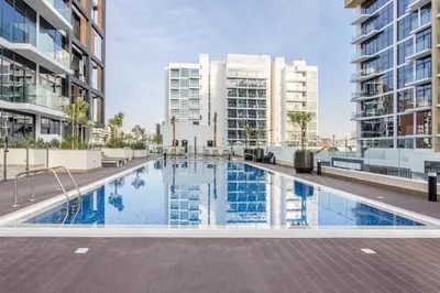 an image of a swimming pool in a building with buildings at Tranquil Studio Retreat in Azizi 34 Near Downtown in Dubai