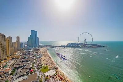 an aerial view of a beach with a ferris wheel at Elegant 2BR Apartment in La Vie, JBR by Deluxe Holiday Homes in Dubai