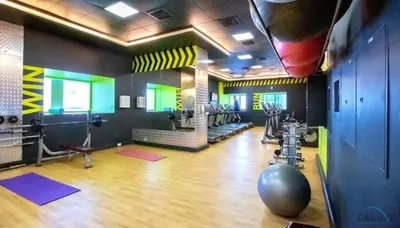 a room with a gym with exercise equipment in it at Modern 1BR Apartment in Elite Residences, Dubai Marina by Deluxe Holiday Homes in Dubai