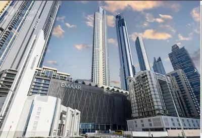 a group of tall buildings in a city at The Address Fountain Views - Residence 2 Bedroom with Burj Khalifa view in Dubai