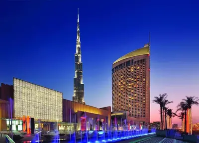 a large building with a tall tower in the background at EMAAR Residences Fashion Avenue Full Burj Khalifa views Studio in Dubai
