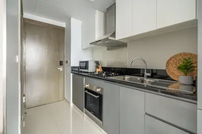 a kitchen with a sink and a counter top at GuestReady - Stylish studio with Dubai Canal view in Dubai