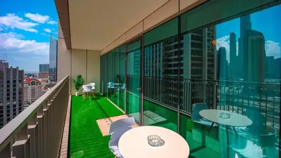 an apartment balcony with a view of the city at Burj Khalifa view with Grass Turf Balcony-Downtown by Tanami Holiday Homes in Dubai