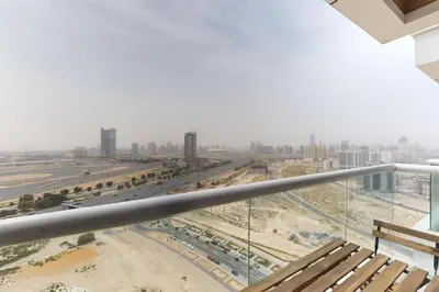 a view of a city from the balcony of a building at Siraj Tower - Colourful Studio in Dubai