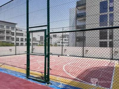 a tennis court with a net on a court at Magnificent studio-One of kind in Dubai in Dubai