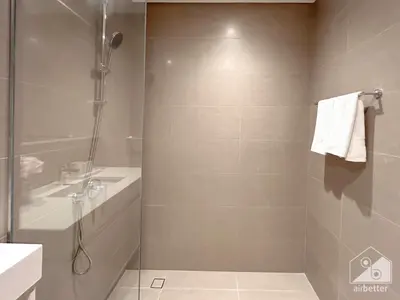 a bathroom with a shower and a sink at Spacious 3.5 Bedroom Apartment in Burj Royale in Dubai
