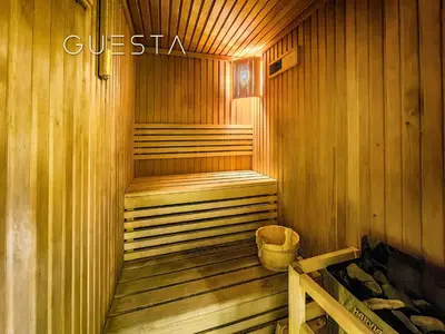 a wooden sauna with a trash can in it at 52 I 42 Tower by Emaar, Dubai Marina in Dubai