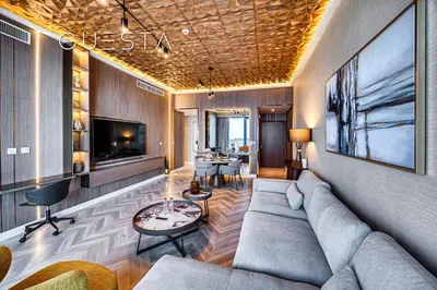 a living room with a couch and a tv at 52 I 42 Tower by Emaar, Dubai Marina in Dubai