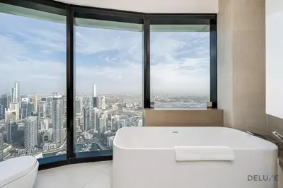 a bathroom with a white tub and a large window at Ultra Luxurious 4BR with Assistant Room in The Address Residences, JBR by Deluxe Holiday Homes in Dubai