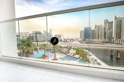a view from a window of a city skyline at Panoramic 2BR - 3 Balconies & Canal Views - Damac Maison Prive by AZCO Holiday Homes in Dubai