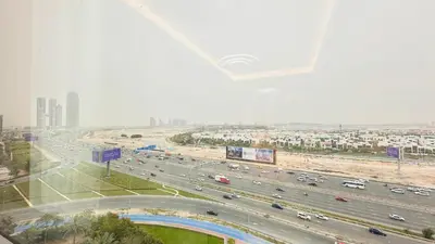 a highway with a lot of traffic in a city at Upscale Studio Apartment Palm View with Big Balcony Free Parking by Belvilla in Dubai