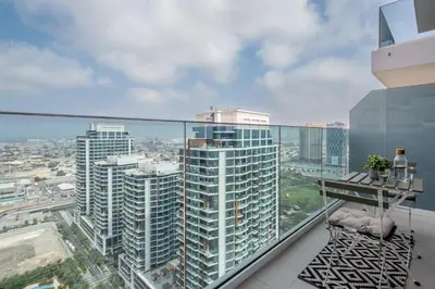 an apartment balcony with a view of a city at Frank Porter - 1 Residences in Dubai