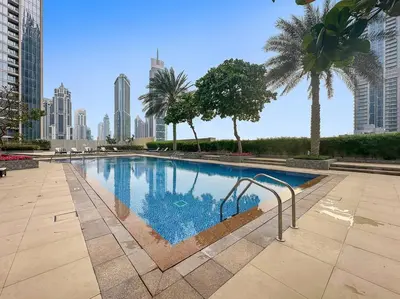 a swimming pool in the middle of a city at FIRST CLASS 2BR Stunning Fountain View in Dubai