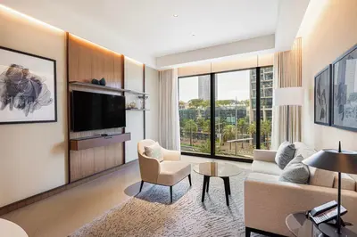 a living room with a couch and a tv at Luxury 1BR The Address Opera, Downtown Dubai in Dubai