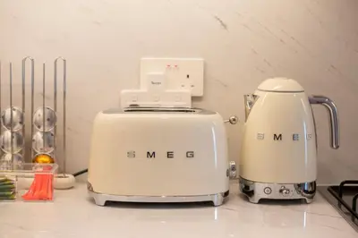 two white toasters sitting on top of a counter at The Palace 405 I Luxury 2BD I Dubai Creek Harbour in Dubai