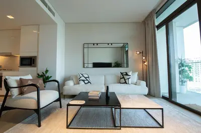 a living room with a couch and a table at The Palace 405 I Luxury 2BD I Dubai Creek Harbour in Dubai
