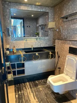 a bathroom with a sink and a toilet and a mirror at Luxurious 2BR in MBL JLT Brand New in Dubai