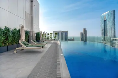 a swimming pool on the roof of a building at Livbnb - Sea and Marina View, Steps to Marina Walk in Dubai