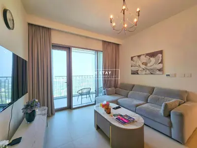 a living room with a couch and a table at Incredible 1BR, Downtown Views II near Dubai Mall in Dubai