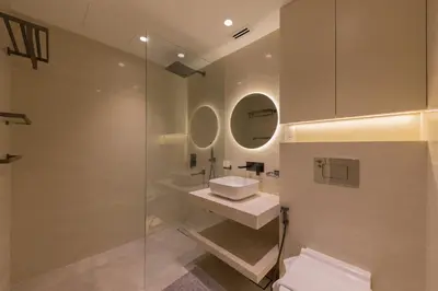 a bathroom with a toilet and a sink and a shower at Luxury Living on the Top Floor Full Marina View in Dubai