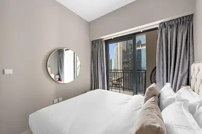 a bedroom with a bed and a window with a view at ALiving Classy 1BR I Close to Dubai Mall I Zada Tower, Business Bay- 1617 in Dubai