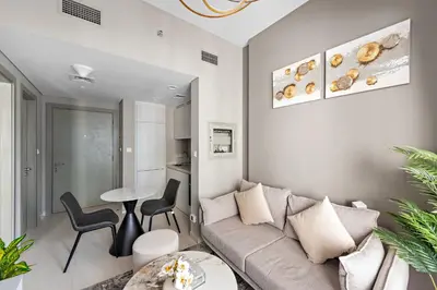 a living room with a couch and a table at ALiving Classy 1BR I Close to Dubai Mall I Zada Tower, Business Bay- 1617 in Dubai