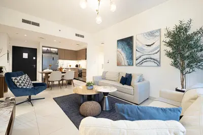a living room with a couch and a table at Burj Crown - First Class Boulevard View, 9 min Walk Dubai Mall in Dubai