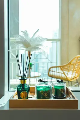 a tray with three vases on a table at Luxury Studio, 29 Boulevard near Burj Khalifa Downtown - Chalet Homes in Dubai