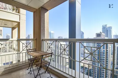 a balcony with a table and chairs on a building at Luxury Escapes - Modern Studio Apt with Balcony near Dubai Mall - 29 Blvd in Dubai