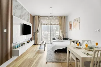 a hotel room with a bed and a dining table at Stylish 1BR in Old Dubai Balcony, Smart TV, Full Kitchen in Dubai