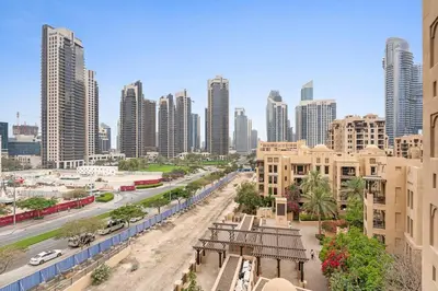 a view of a city with tall buildings and a street at Stylish 1BR in Old Dubai Balcony, Smart TV, Full Kitchen in Dubai