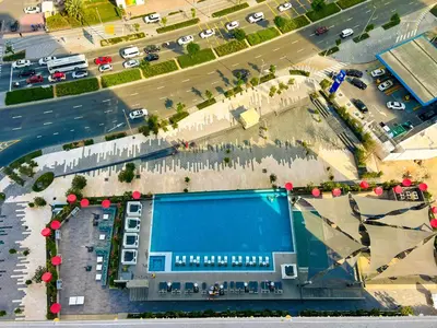 an aerial view of a building with a swimming pool at MAG318, Modern Studio Apartment with Great Amenities and Canal View, 5min Walk to Dubai Mall in Dubai