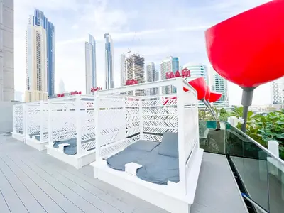 a balcony with a view of a city at MAG318, Modern Studio Apartment with Great Amenities and Canal View, 5min Walk to Dubai Mall in Dubai