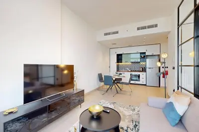 a living room with a large aquarium in the middle of it at Socio Tower 2 - Neat Two Bedroom in Dubai