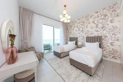 a hotel room with two beds and a couch at Fantastic and Rare 4BR+maid's in JBR Walk in Dubai