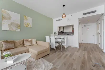 a living room with a couch and a table at Comfortable 1BR Apartment in Marina Tower, Dubai Marina by Deluxe Holiday Homes in Dubai