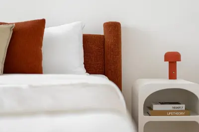 a bedroom with a bed and a side table at TH-Homes designed apartment Downtownview in Dubai