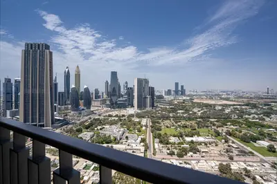 a view of a city skyline from a balcony at TH-Homes designed apartment Downtownview in Dubai