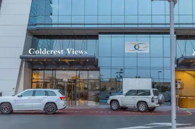 two white cars parked in front of a building at Click Stay - JLT - Entire Studio & Balcony Lakes view Apartment -AM in Dubai