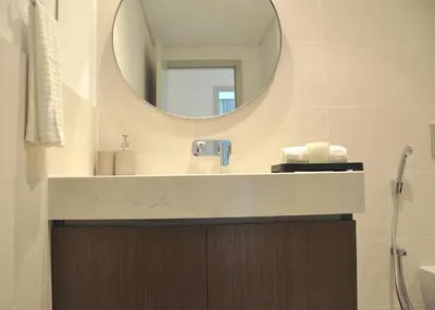 a bathroom with a sink and a mirror at Sea Breeze Oasis in Dubai