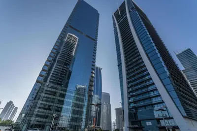 two tall skyscrapers in a city with at Click Stay - JLT - Studio & Balcony Lakes view Entire Apartment -JN in Dubai