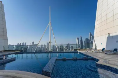 a large swimming pool on top of a building at Click Stay - JLT - Studio & Balcony Lakes view Entire Apartment -JN in Dubai