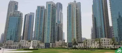 a group of tall buildings in a city at Incredible Fountain Views 2.5 BR Burj Residences in Dubai