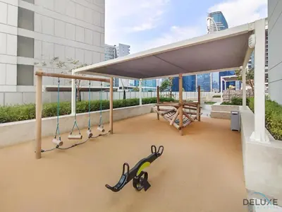 awning on the roof of a building with scissors at Exclusive Rate 1BR with Partial Burj Khalifa Views by Deluxe Holiday Homes in Dubai