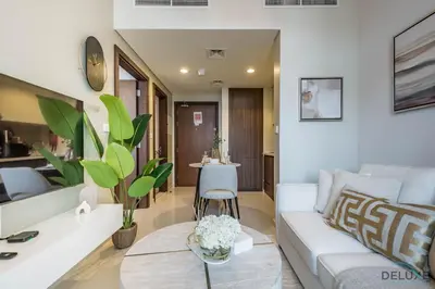 a living room with a white couch and a table at Exclusive Rate 1BR with Partial Burj Khalifa Views by Deluxe Holiday Homes in Dubai