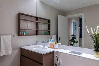 a bathroom with a sink and a mirror at Goldbest La Mer - Luxury 1 bdr Apartment with Beachfront Pool in Dubai