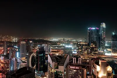 a view of a city at night at SmartStay at Burj Royale - Unique Downtown Dubai City Views - Brand New Luxury Apartments in Dubai